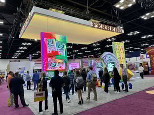crowd standing in front of Ferrero display booth at NCA Expo 2024