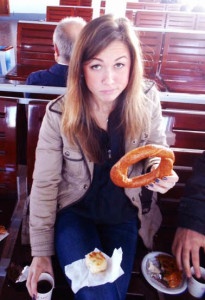 Amanda enjoying "simit" and börek while aboard a sea bus in Istanbul, photo credit goes to her Turkish friend whom she visited nearly a year ago.  